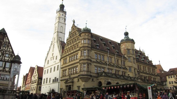 the city hall of rothenburg ob der tauber, with weihnachtsmarkt vendor stalls situated on marktplatz